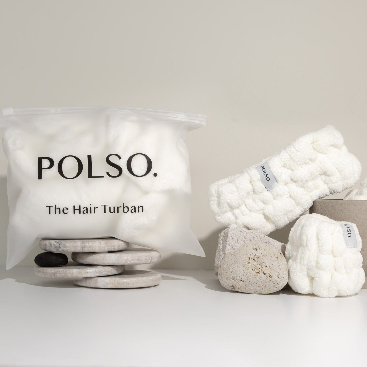 Spa White Hair Turban Headband and Wash Cuff Product Image on stones