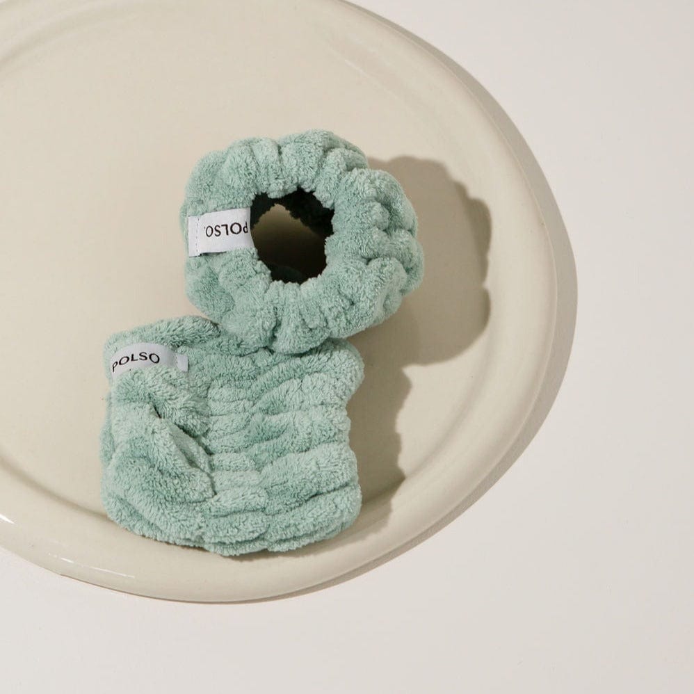 Sage green wash cuffs on stone plate