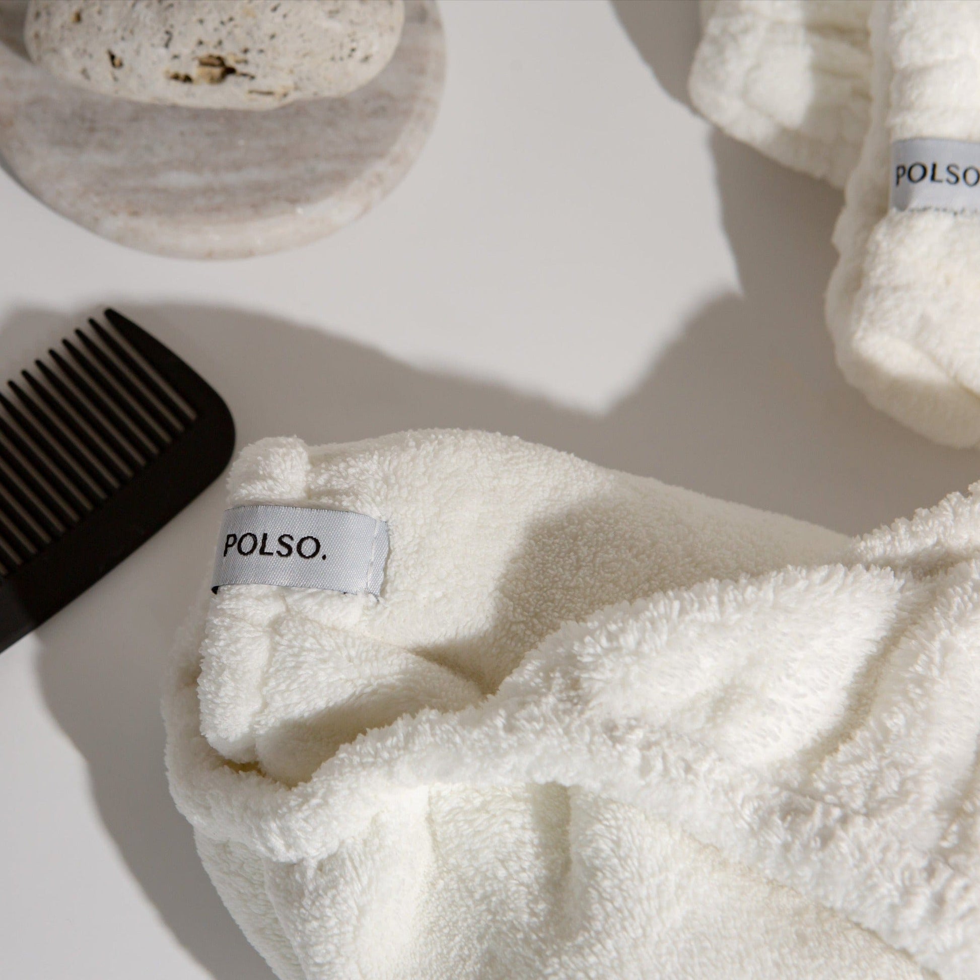 Spa White Hair Turban Close Up Next To Comb