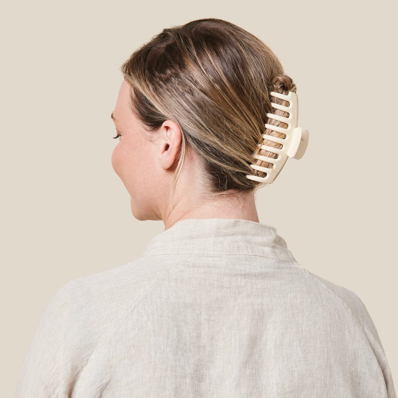 White hair clip on model view from behind