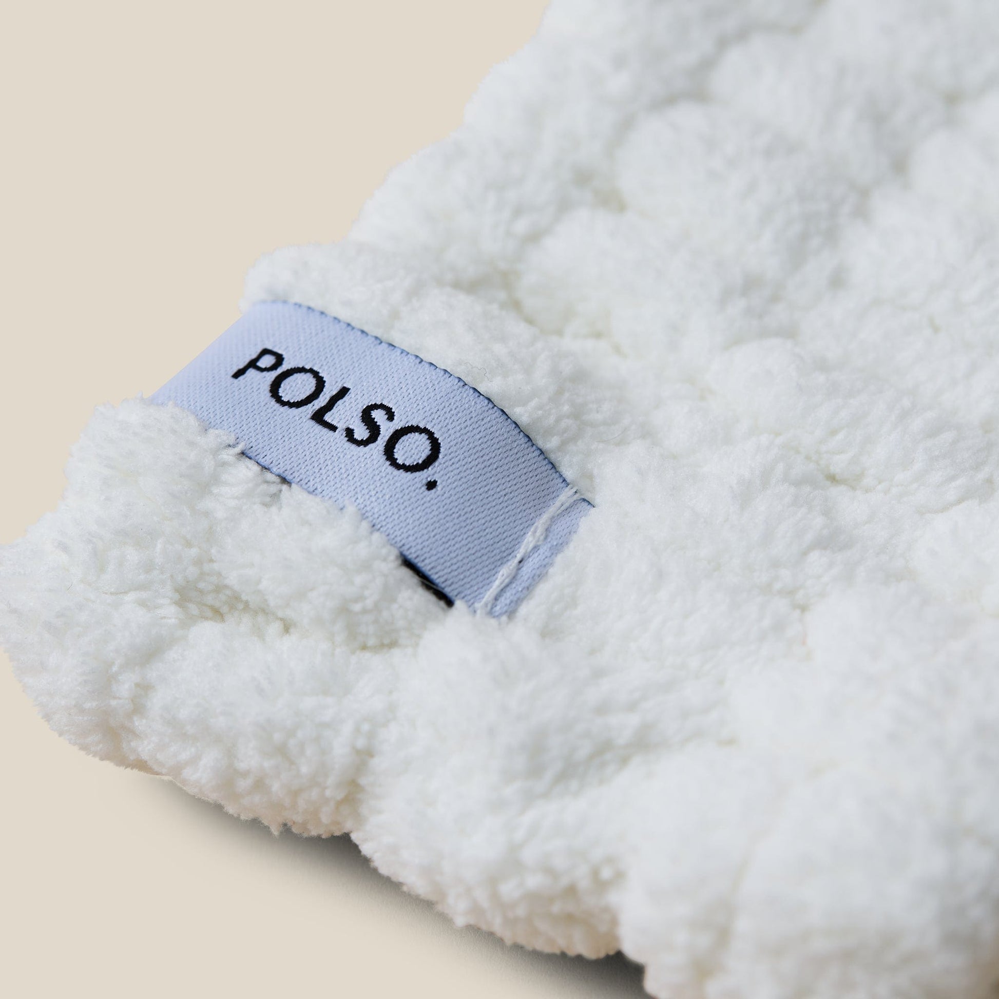 White Spa Headband Product Photo Close Up with POLSO Logo