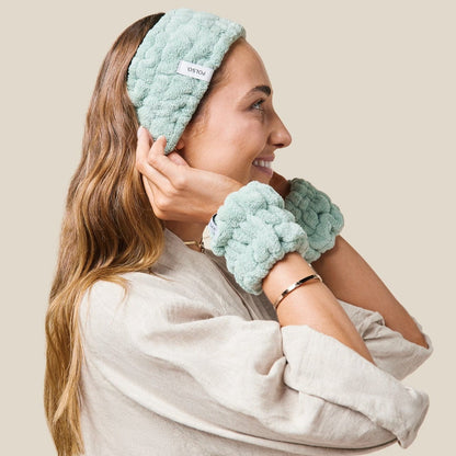 model wearing Sage green wash cuffs and headband side on view