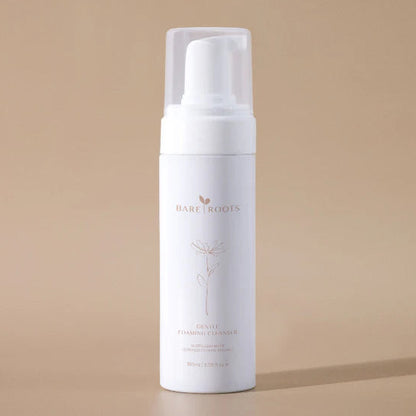 White foam bottle with 'Bare Roots' branding on a beige background
