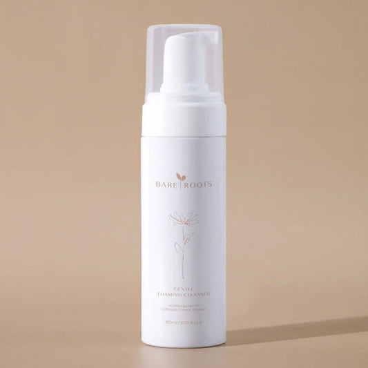 White foam bottle with 'Bare Roots' branding on a beige background