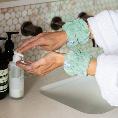 Sage Green Wash Cuffs on wrists washing face