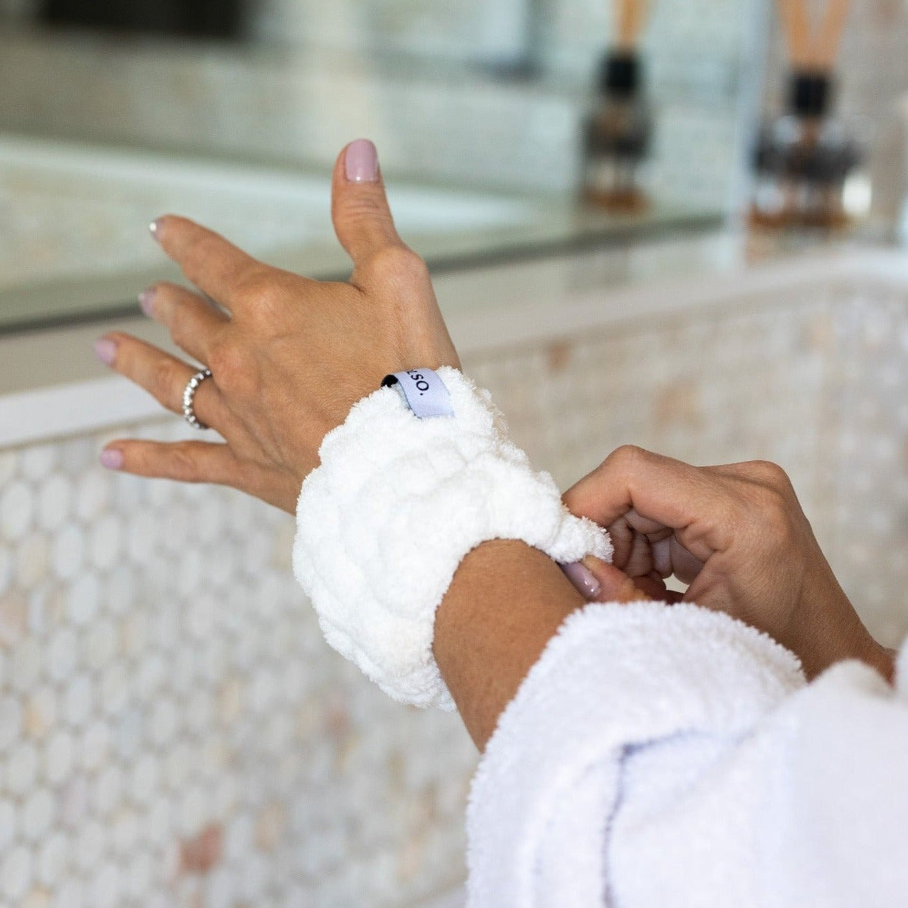 Spa White Wash Cuffs on wrists washing face